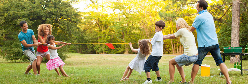 Family playing tug of war