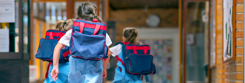 private school children running into school