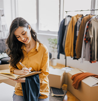 Woman receiving orders and packing boxes