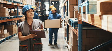 A group of workers working in a warehouse