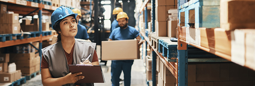 A group of workers working in a warehouse