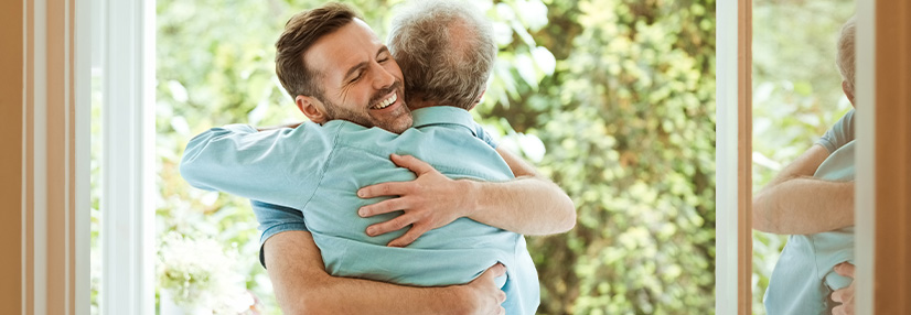 Dad hugging son