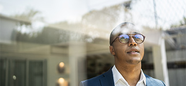 Man reflecting on how his finances reflect his professional standards