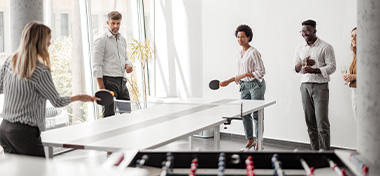 Office People Playing Table Tennis in Workplace