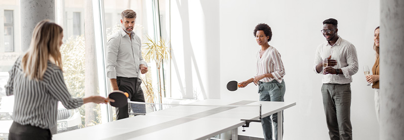 Office People Playing Table Tennis in Workplace