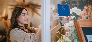 Woman opening her shop