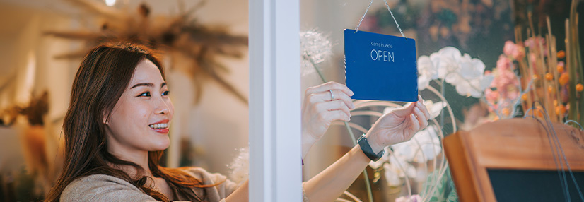 Woman opening her shop