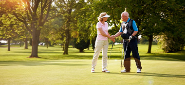 Couple enjoying their retirement together playing golf