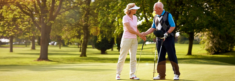 Couple enjoying their retirement together playing golf