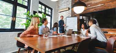 Business people watching a presentation on the whiteboard