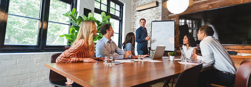 Business people watching a presentation on the whiteboard