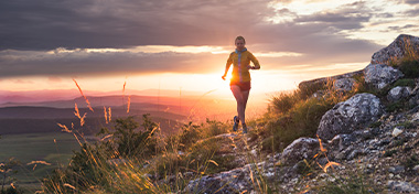 Woman running up a hill
