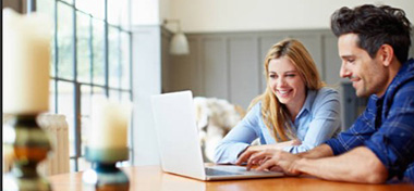 Couple looking at the laptop