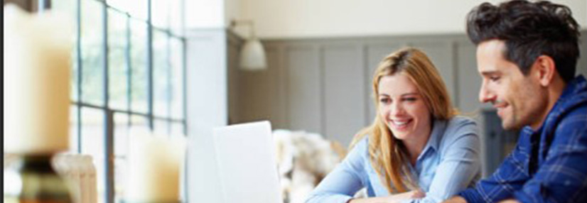 Couple looking at the laptop