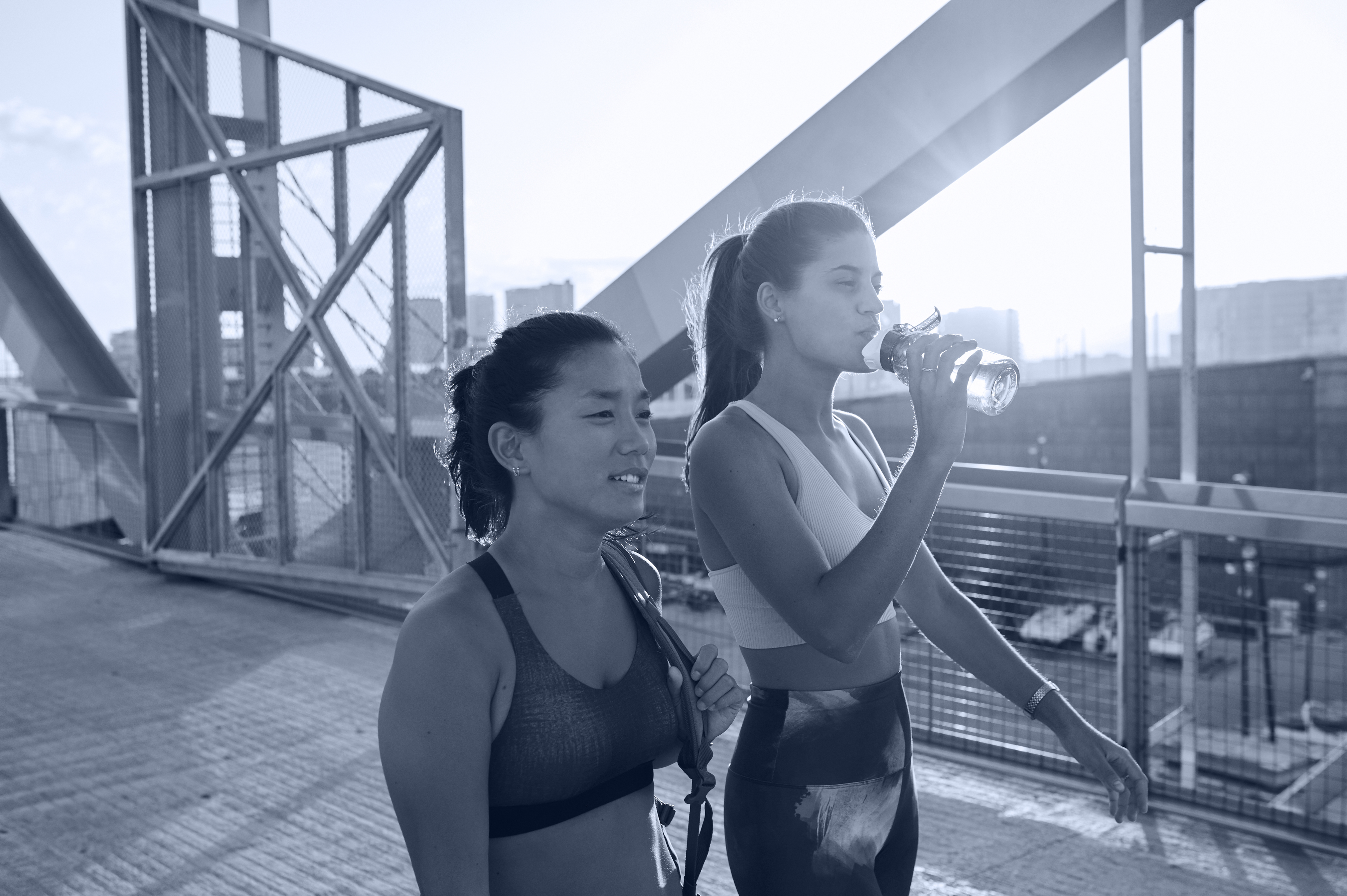 women with water bottles