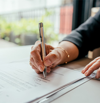 Someone signing documents