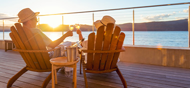Couple enjoying life abroad overlooking the sea