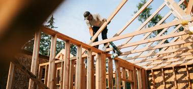 Builder building a house