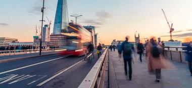 Commuters walking over London bridge