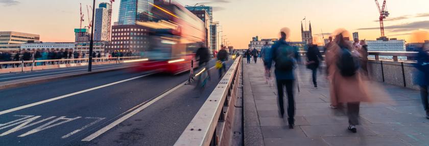 Commuters walking over London bridge