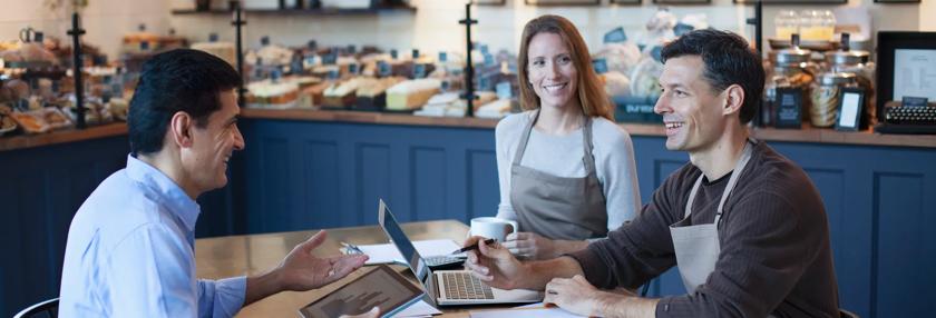 business owners with financial adviser