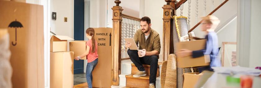 A Dad moving him and his kids into their new home