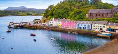 Skye island Portree Harbour colorful houses in Highlands Scotland UK