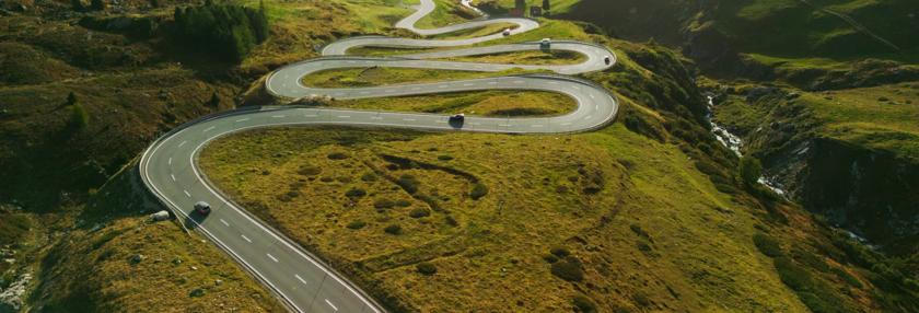 View of serpentine road in Swiss Alps in autumn