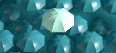 One umbrella standing out against others