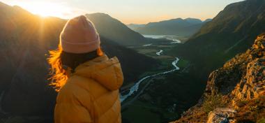 woman at the top of a mountain