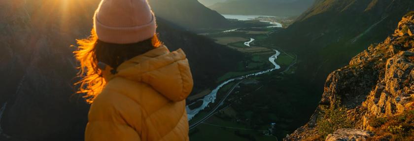 woman at the top of a mountain