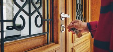 Man opening the front door of his vacation rental