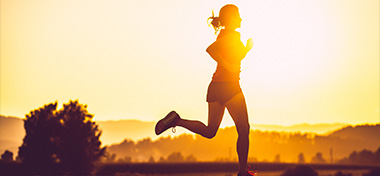 Adult woman running outdoors