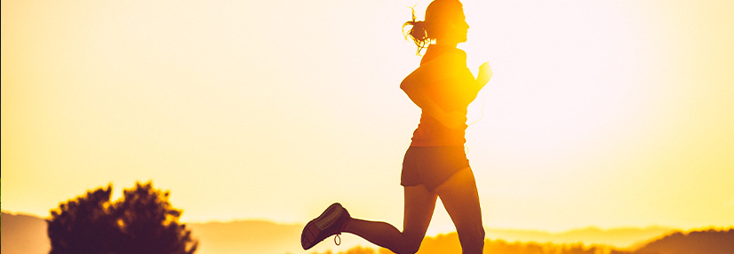 Adult woman running outdoors