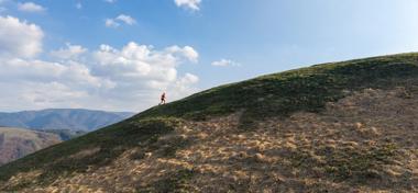Man climbing up a mountain