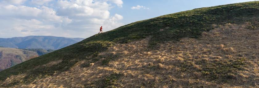 Man climbing up a mountain