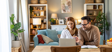 Couple looking at the laptop