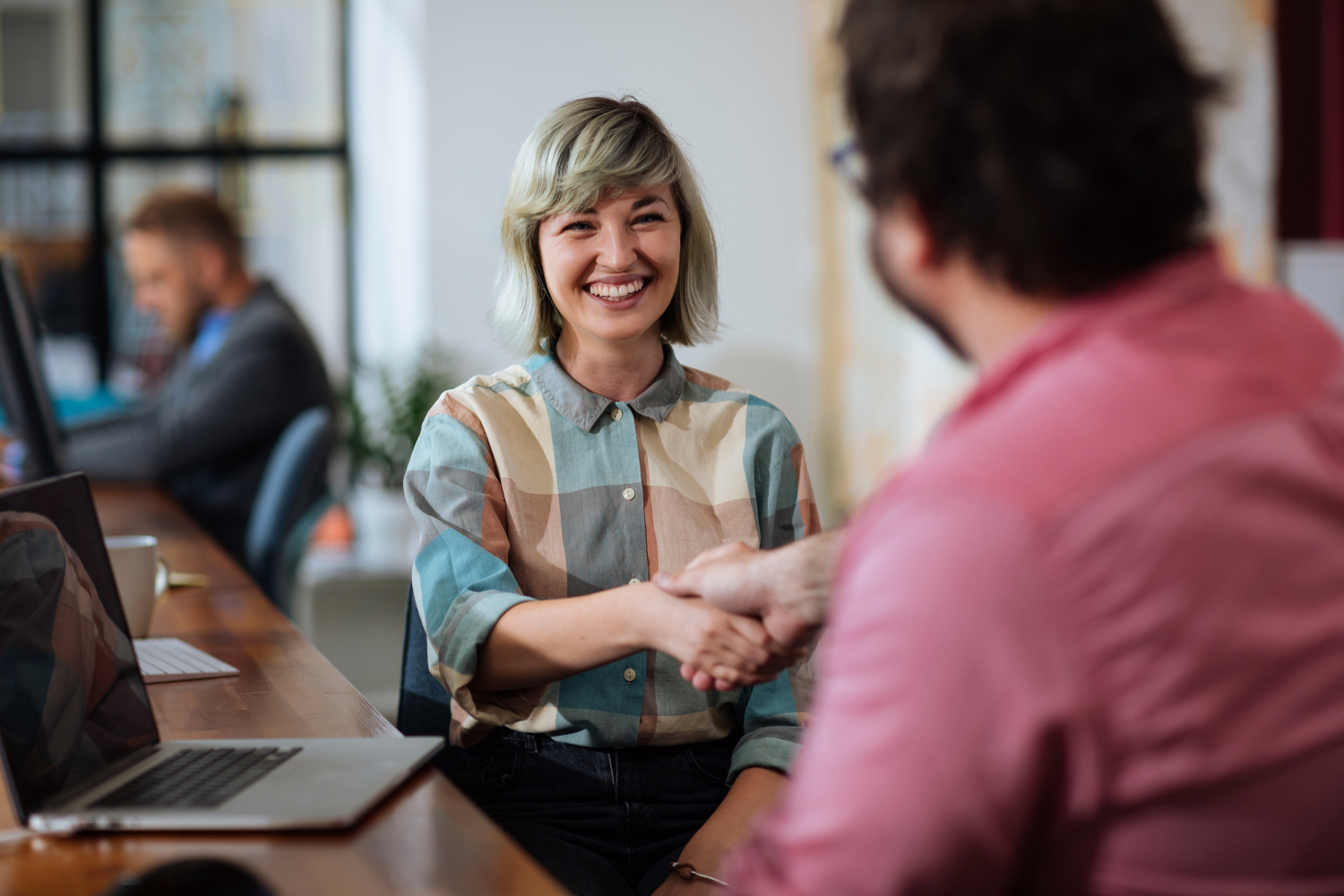 Woman shaking hand