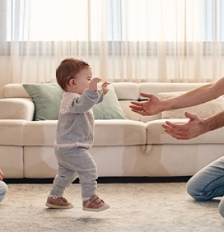 Mum and Dad with baby's first walk