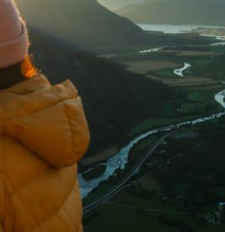 woman at the top of a mountain
